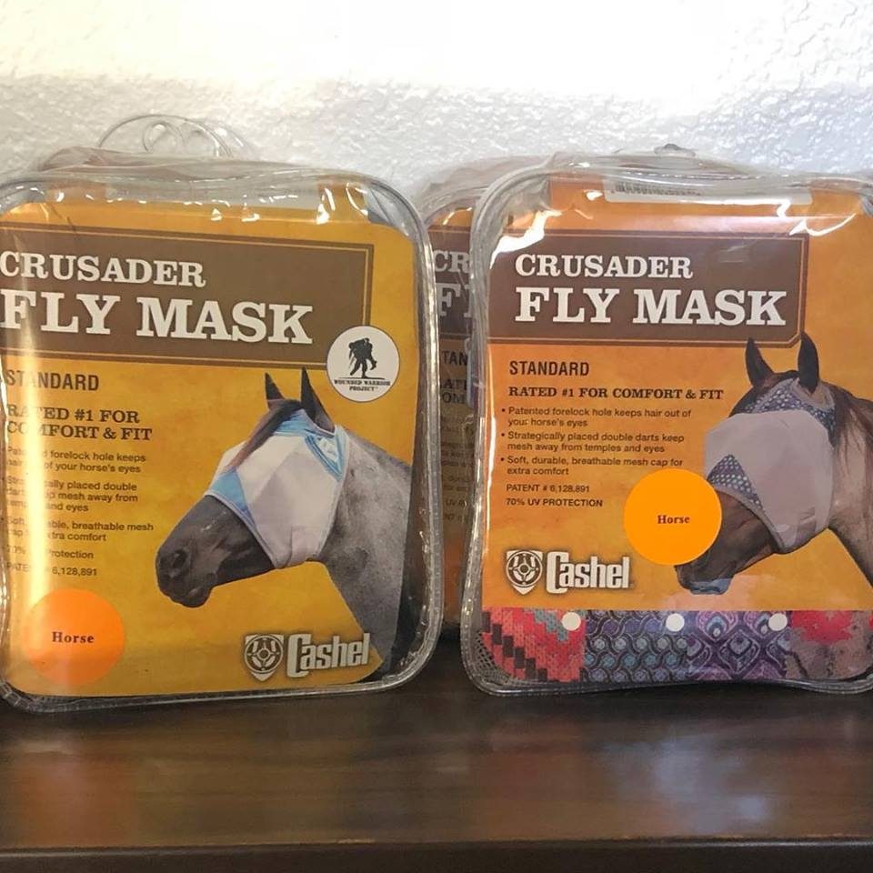 Two packaged Cashel Crusader fly masks on a shelf