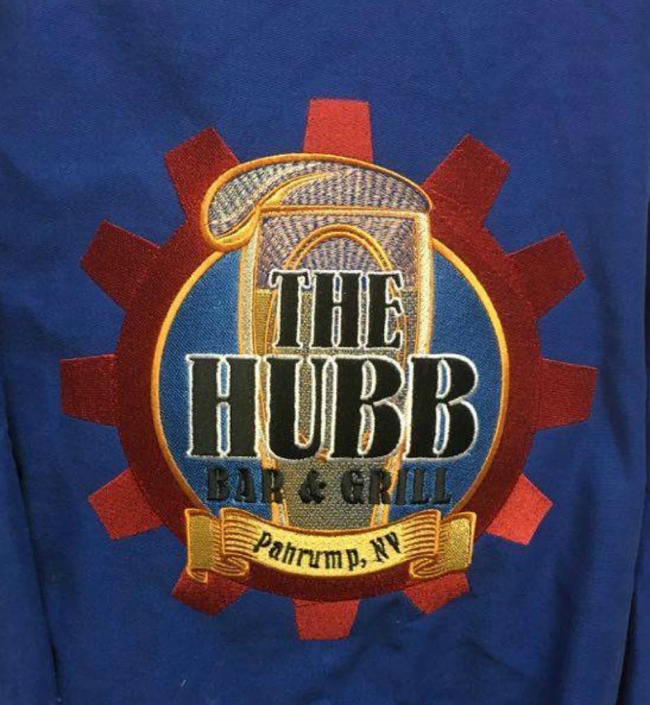Royal blue shirt with a large embroidered gear logo reading The Hubb Bar and Grill, Pahrump NV
